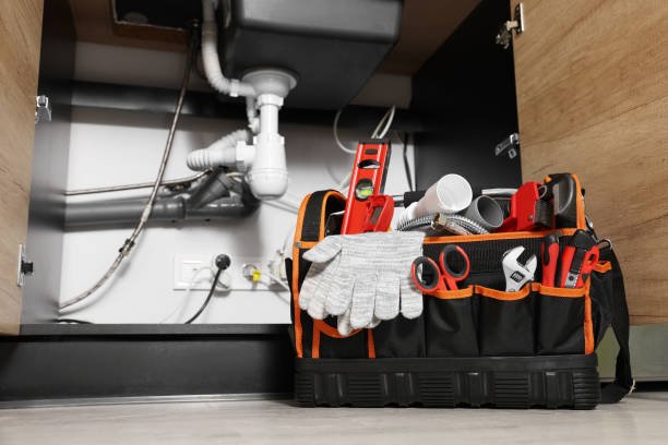 A tool bag filled with various tools and plumbing supplies used for plumbing repairs in Homestead FL